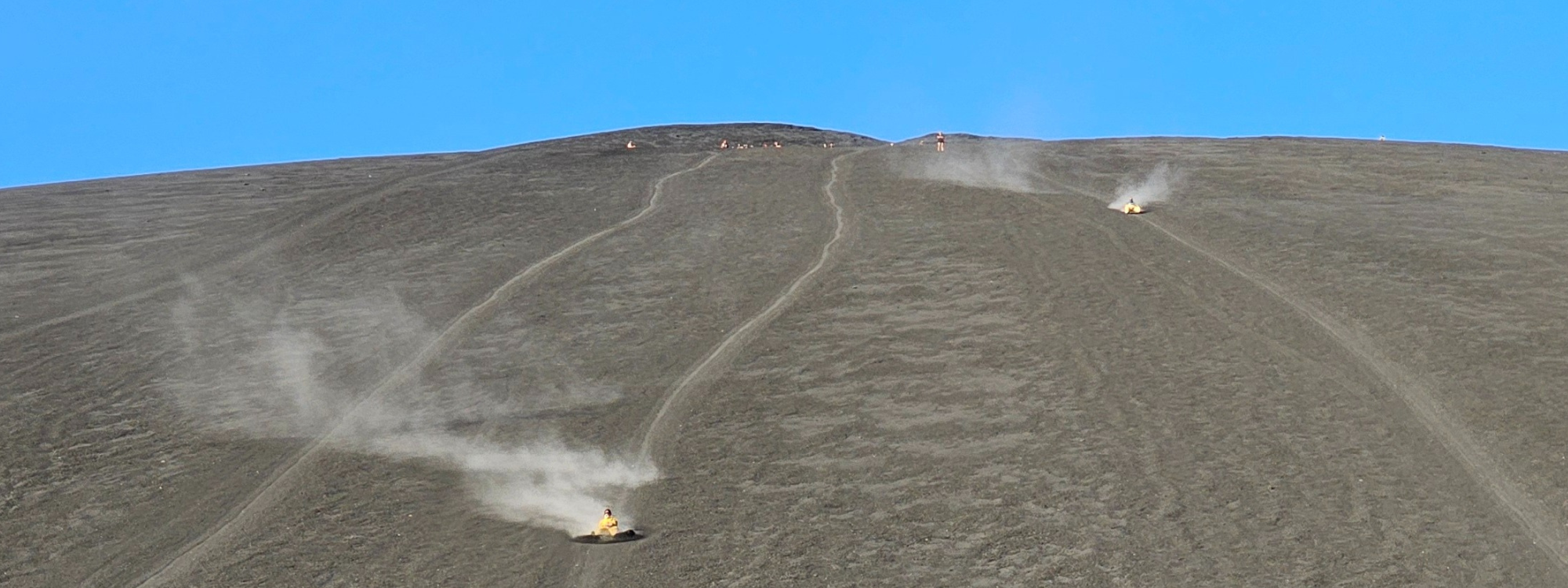 Daredevils volcano boarding in Leon